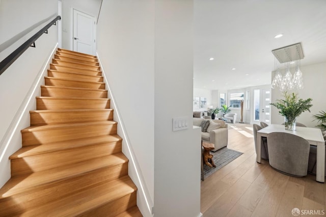 stairs featuring wood-type flooring