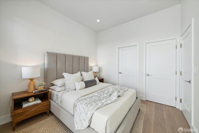 bedroom with light hardwood / wood-style flooring