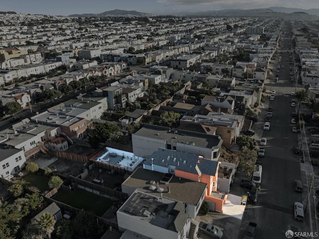 birds eye view of property featuring a mountain view