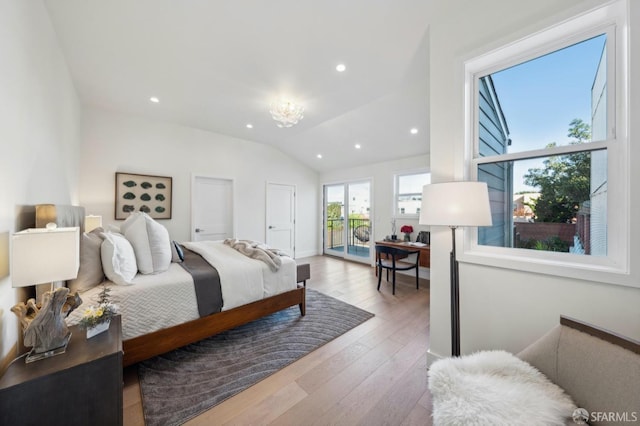 bedroom with lofted ceiling, access to exterior, and light wood-type flooring