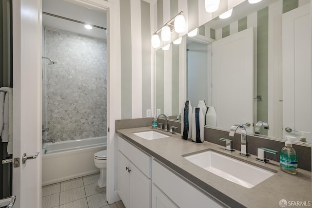 full bath featuring  shower combination, a sink, toilet, and double vanity