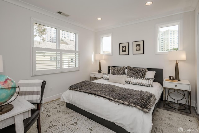 bedroom with ornamental molding, multiple windows, visible vents, and recessed lighting