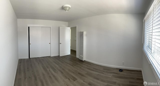 1646 19th Ave, San Francisco, CA 94122 - unfurnished bedroom featuring a heating unit, wood finished floors, and a closet