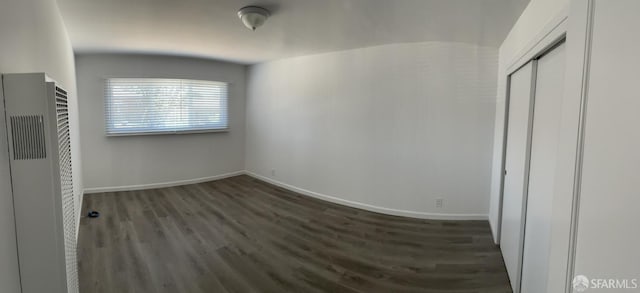 1646 19th Ave, San Francisco, CA 94122 - unfurnished bedroom featuring a heating unit, wood finished floors, and a closet