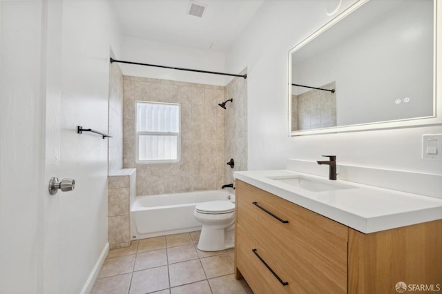 full bathroom with tile patterned floors, vanity, toilet, and tiled shower / bath