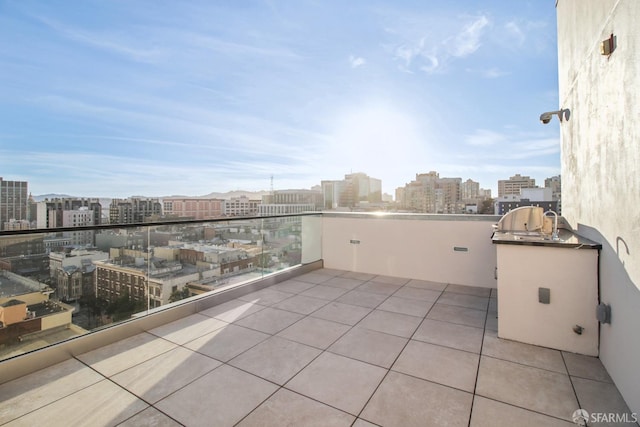 view of patio featuring a balcony