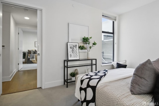 bedroom featuring light colored carpet