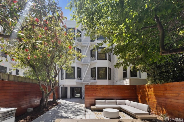 1234 Francisco St Unit 6, San Francisco, CA 94123 - rear view of house with stairs and outdoor lounge area