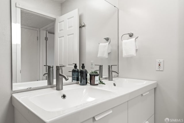 bathroom featuring double vanity