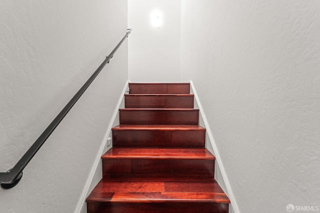 stairway with a textured wall