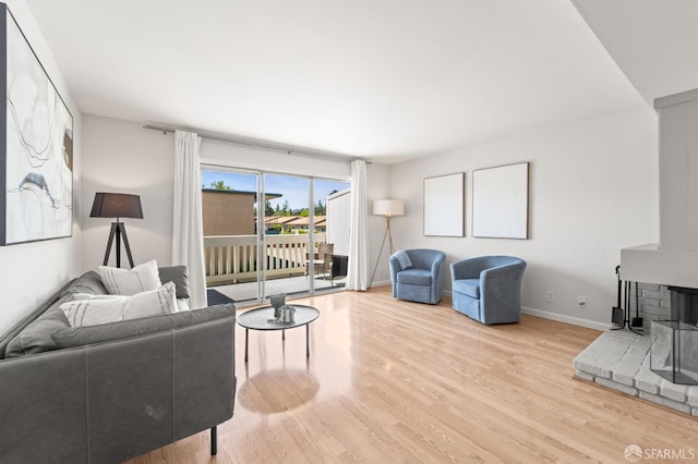 living area featuring wood finished floors and baseboards