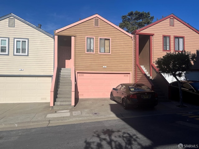 view of front of house with entry steps and a garage