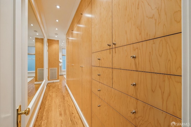 hall featuring recessed lighting, visible vents, and light wood-style flooring