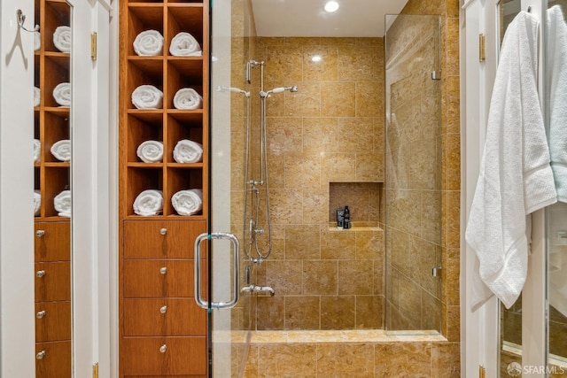 bathroom featuring a shower stall