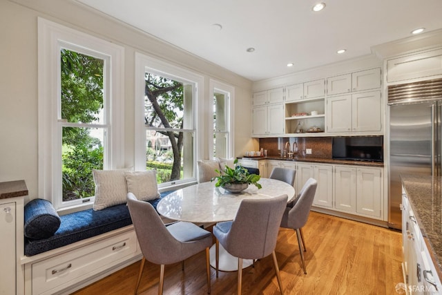 dining area with recessed lighting and light wood-type flooring