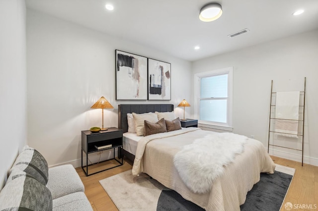 bedroom with light hardwood / wood-style flooring