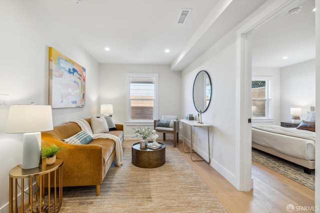 sitting room featuring light hardwood / wood-style flooring