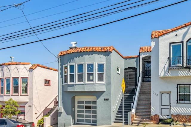 mediterranean / spanish-style house featuring a garage