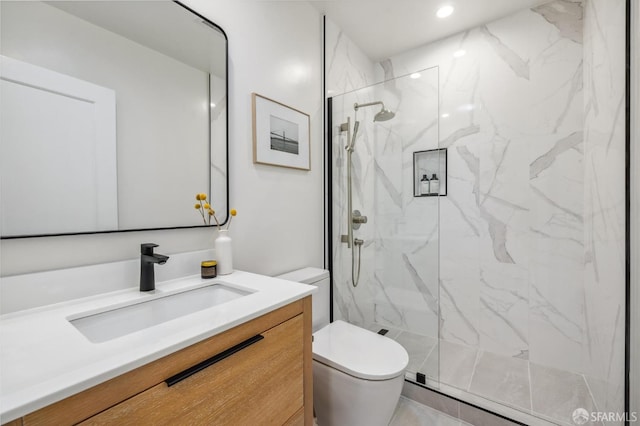 bathroom with vanity, toilet, and walk in shower