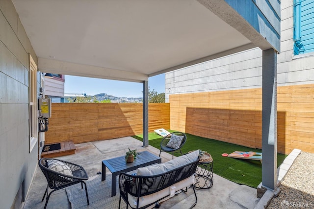 view of patio / terrace with outdoor lounge area and a mountain view