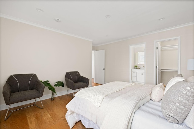3044 Franklin St Unit 302, San Francisco, CA 94123 - bedroom featuring crown molding, light wood finished floors, a closet, and connected bathroom