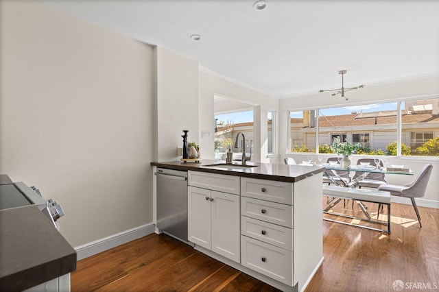 3044 Franklin St Unit 302, San Francisco, CA 94123 - kitchen with dishwasher, dark countertops, a sink, a peninsula, and dark wood-style floors