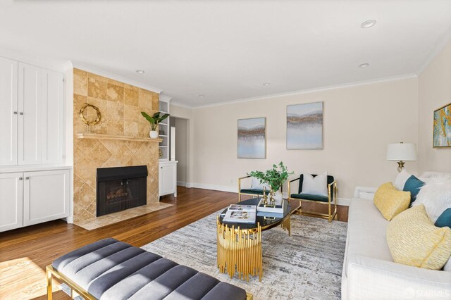 3044 Franklin St Unit 302, San Francisco, CA 94123 - living room with wood finished floors, a fireplace, ornamental molding, recessed lighting, and baseboards