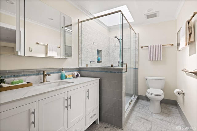 3044 Franklin St Unit 302, San Francisco, CA 94123 - bathroom with marble finish flooring, toilet, a shower stall, vanity, and ornamental molding