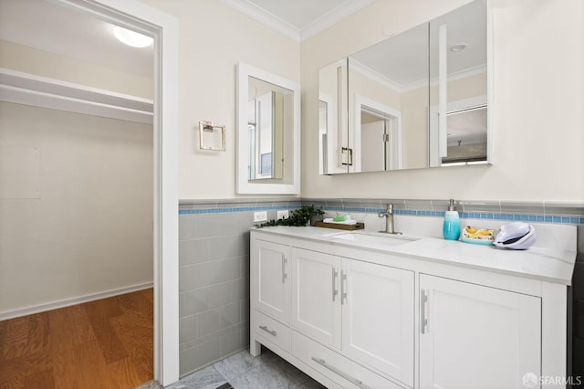 3044 Franklin St Unit 302, San Francisco, CA 94123 - bathroom with ornamental molding, tile walls, vanity, and a wainscoted wall