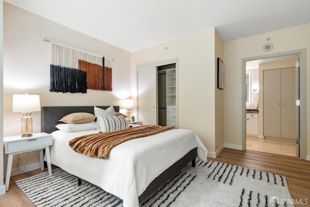333 1st St Unit N307, San Francisco, CA 94105 - bedroom with wood finished floors, a closet, and ensuite bath