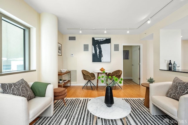 333 1st St Unit N307, San Francisco, CA 94105 - living room featuring wood finished floors and rail lighting