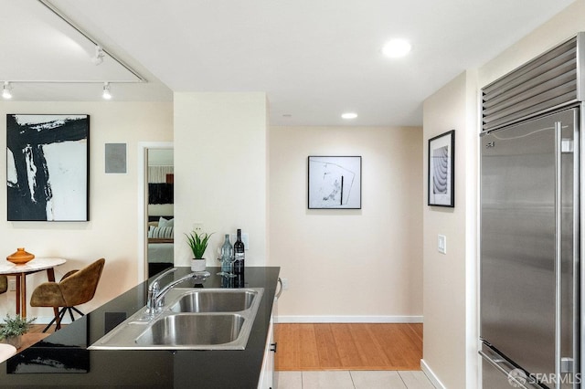 333 1st St Unit N307, San Francisco, CA 94105 - kitchen featuring stainless steel built in fridge, rail lighting, recessed lighting, and light wood finished floors