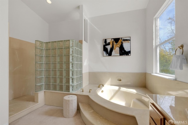 full bath featuring walk in shower, vanity, and a bath