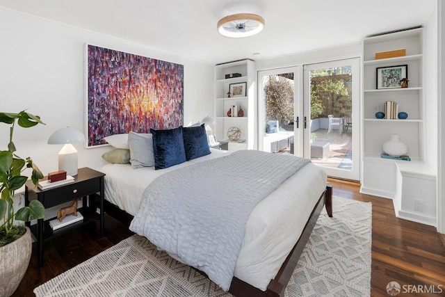 bedroom with access to exterior, dark wood-type flooring, and french doors