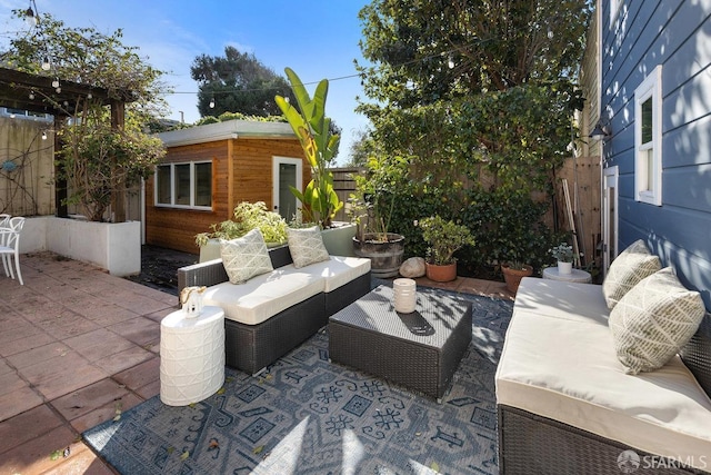 view of patio with an outbuilding and an outdoor hangout area