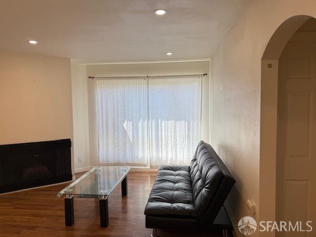 397 Imperial Way Unit 306, Daly City, CA 94015 - living area with arched walkways, baseboards, recessed lighting, and wood finished floors