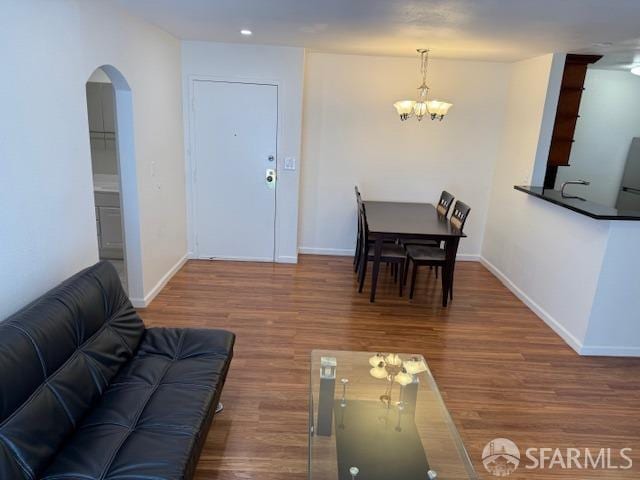 397 Imperial Way Unit 306, Daly City, CA 94015 - living area with wood finished floors, baseboards, recessed lighting, a chandelier, and arched walkways