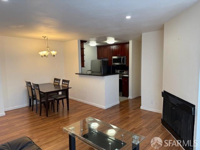 397 Imperial Way Unit 306, Daly City, CA 94015 - living area with recessed lighting, baseboards, a chandelier, and wood finished floors