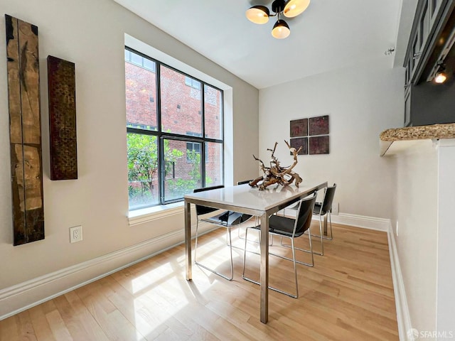 1 Bluxome St Unit 317, San Francisco, CA 94107 - dining space featuring light wood-type flooring and healthy amount of natural light