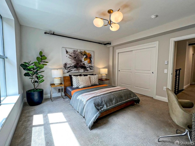 1 Bluxome St Unit 317, San Francisco, CA 94107 - bedroom with carpet floors, a chandelier, and a closet