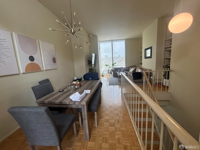 dining space with an inviting chandelier and expansive windows