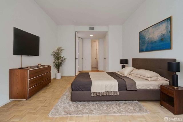 bedroom with visible vents and baseboards