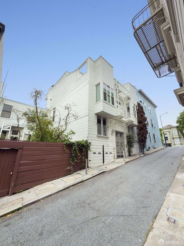 view of side of home with fence