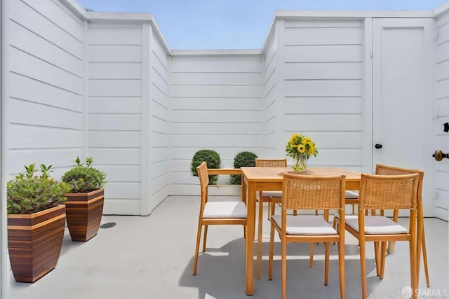 view of patio featuring outdoor dining area