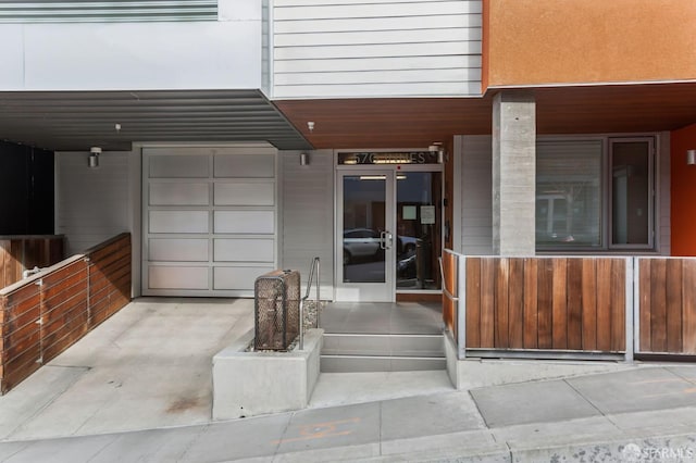 doorway to property with a garage