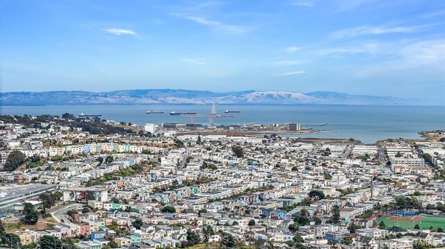 bird's eye view featuring a water and mountain view