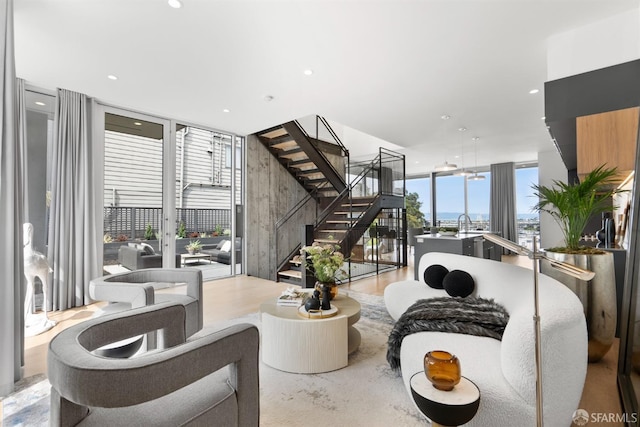 living room with expansive windows and a healthy amount of sunlight