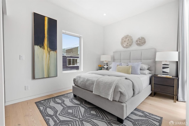 bedroom with hardwood / wood-style floors