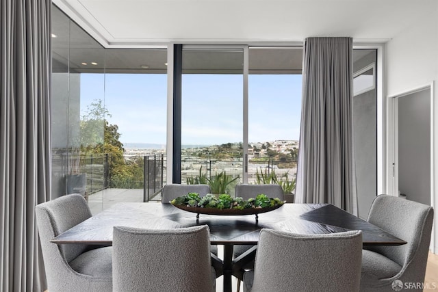 dining room with floor to ceiling windows