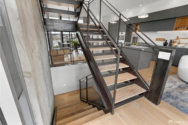 stairs with wood-type flooring